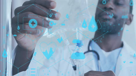animation of network of medical icons over african american male doctor checking drip bag
