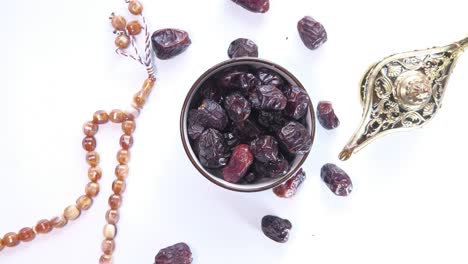 dates, prayer beads, and a golden lamp: a ramadan still life