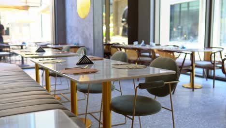 front view of stylish and light dining table in restaurant close up shot