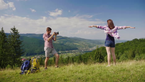 The-Guy-Takes-Pictures-Of-His-Girlfriend-In-A-Picturesque-Place-On-The-Background-Of-The-Mountains-N