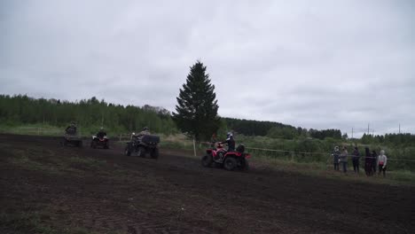 atv competition in a muddy forest