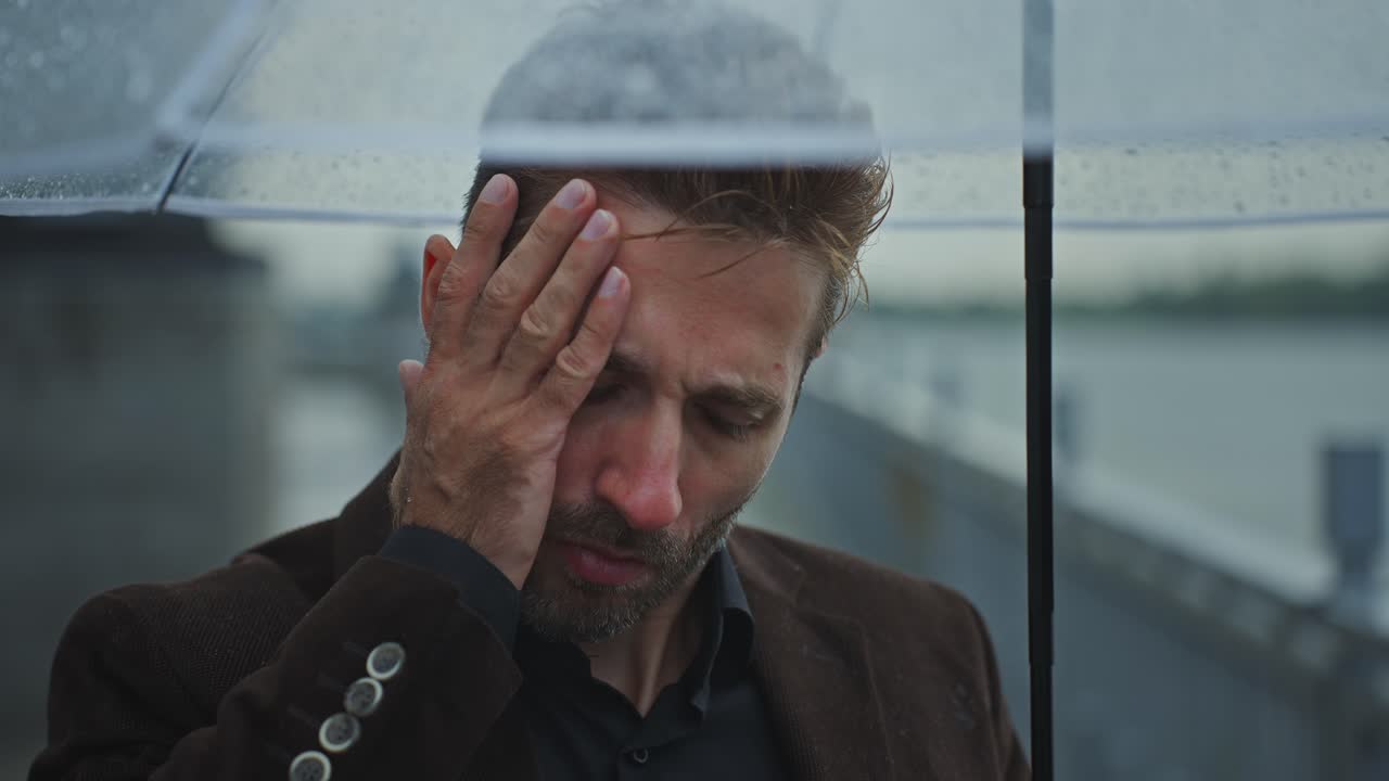 Man Under Umbrella in the Rain