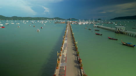 pier and boats at a tropical harbor