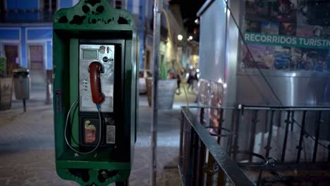 old telephone booth at night