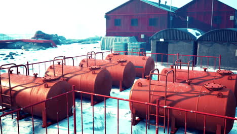 red fuel tanks at an antarctic research station