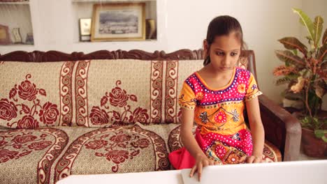 portrait of an indian child at home during coronavirus lockdown