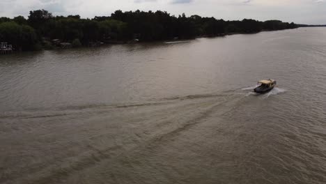 A-taxi-boat-sails-by-on-the-Parana-River-delta-in-Buenos-Aires-in-Argentina