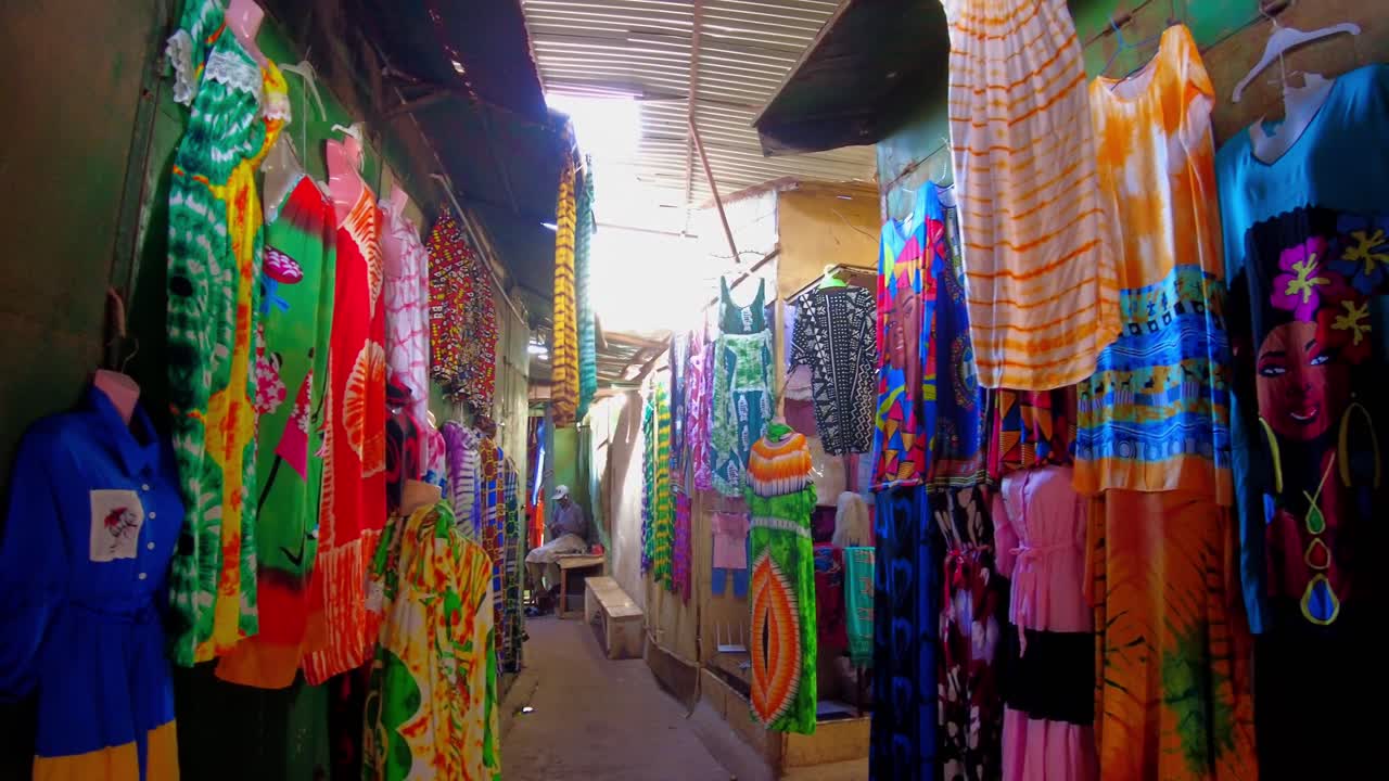Vibrant African Market: Colorful Clothing and Textiles