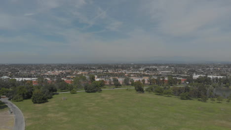 drone descends in suburban park