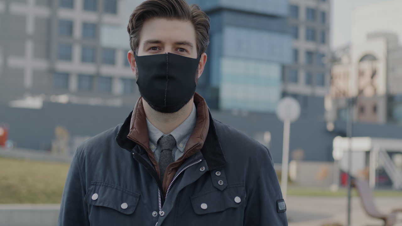 Man Wearing Mask in Urban Setting