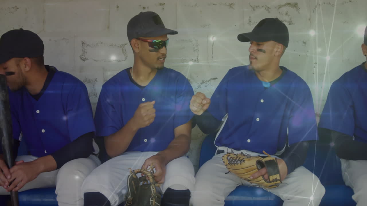 In dugout, baseball players interacting with digital network animation overlay