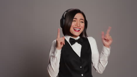 front desk staff dancing around in studio and listening to music