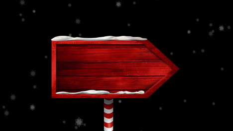 animation of wooden sign with copy space over snow falling