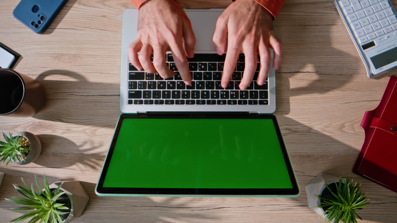 Hands typing report mockup laptop in corporate workspace closeup top view