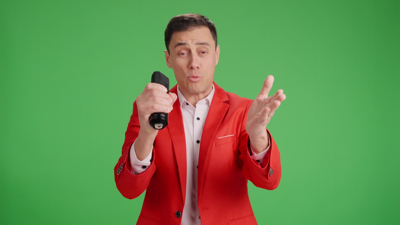 Enthusiastic showman introducing performer on green screen