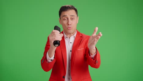 enthusiastic showman introducing performer on green screen