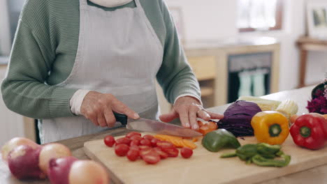 hands, knife and vegetables in kitchen