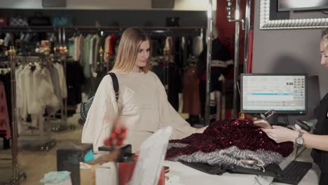 woman shopping for clothing at a retail store