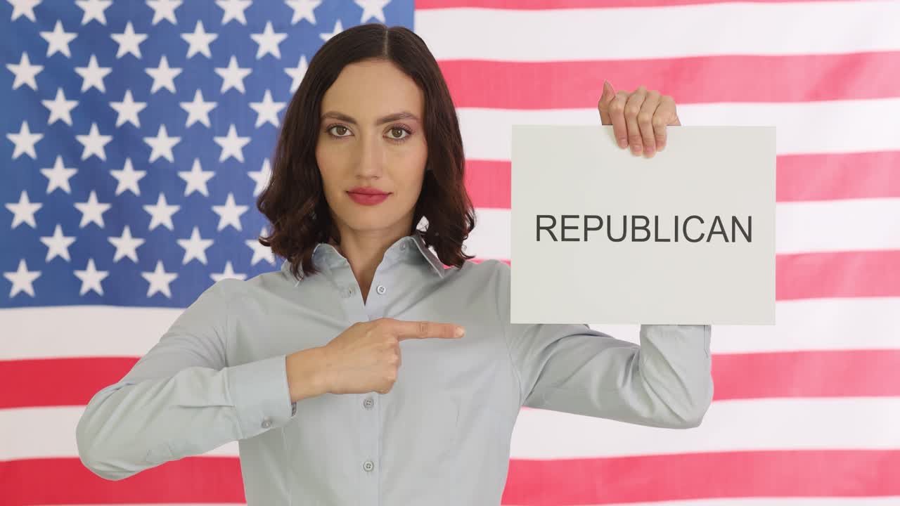 Woman Holding "REPUBLICAN" Sign in front of American Flag
