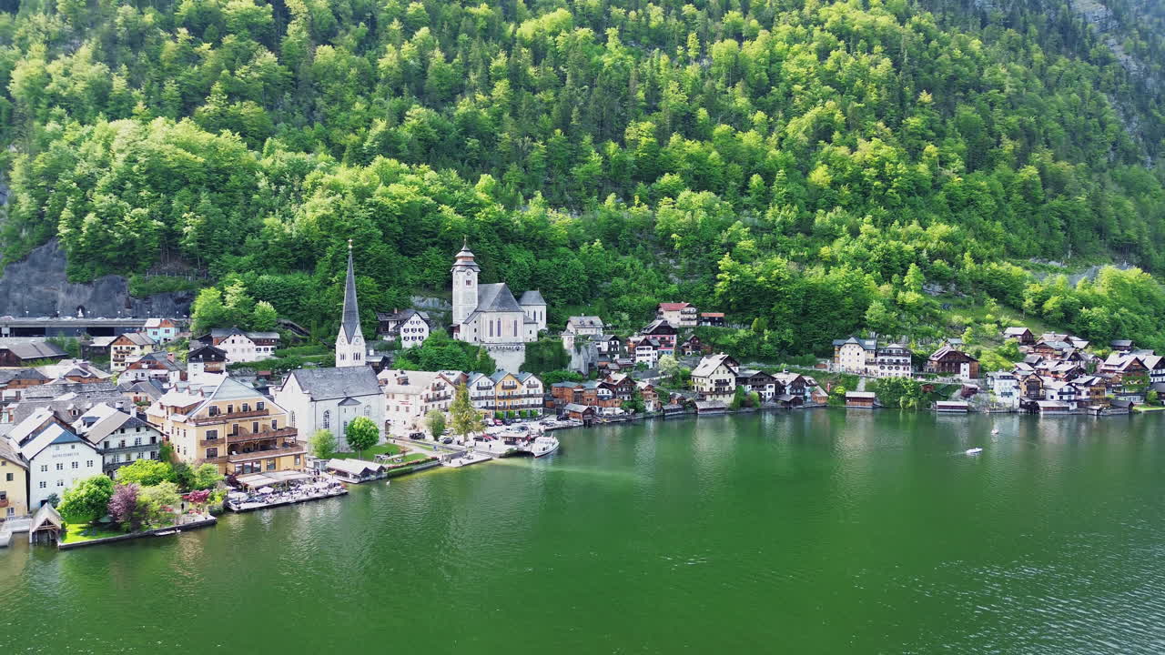Evangelical And Catholic Churches At Hallstatt, Austria. - aerial pullback shot
