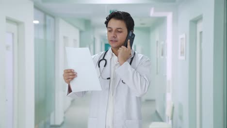 Indian-doctor-explaining-medical-report-on-call