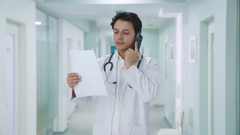 indian doctor explaining medical report on call