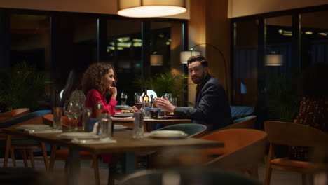 Multiethnic-lovers-talking-together-on-restaurant-dinner-date.-Romantic-concept.