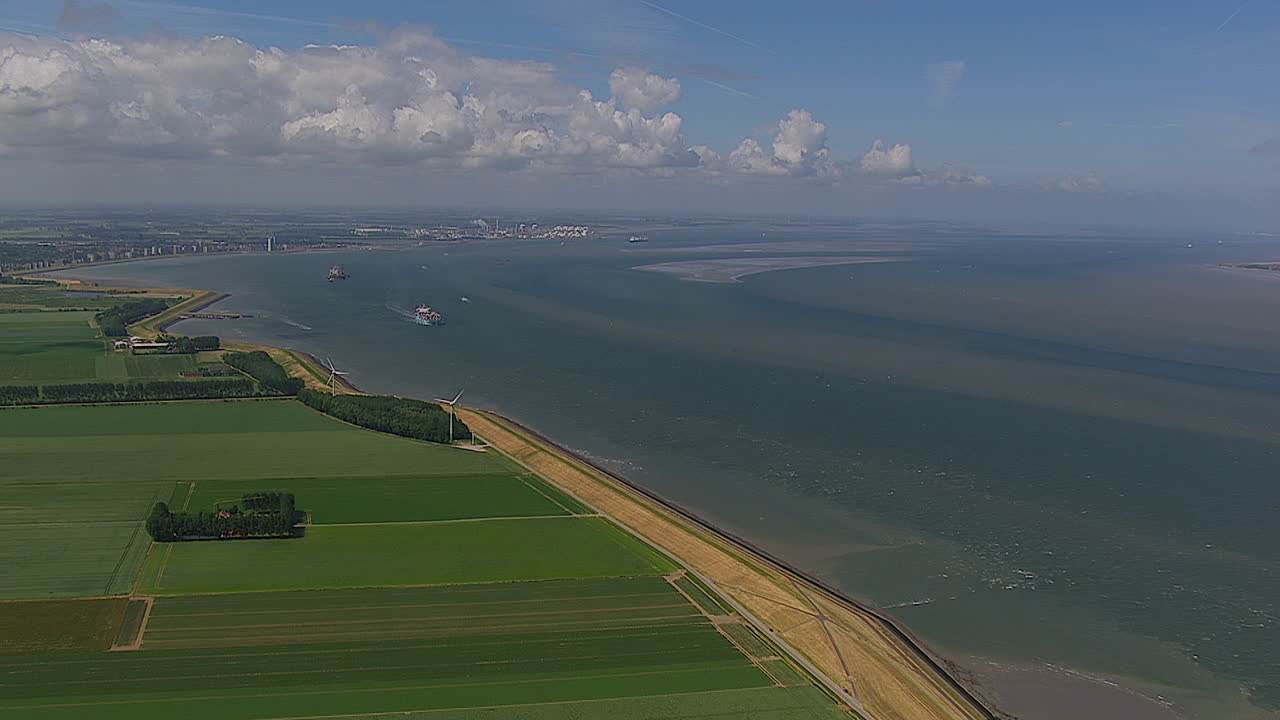 flying along the banks of the river watching the cargo boats go by