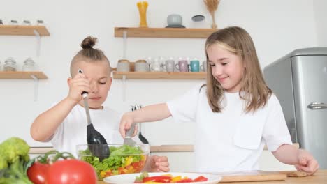 Children Cooking Food at Home in the Kitchen with Fresh Vegetables Vegetarian Healthy Food Children Cooking Food at Home in the Kitchen with Fresh Vegetables Vegetarian Healthy Food