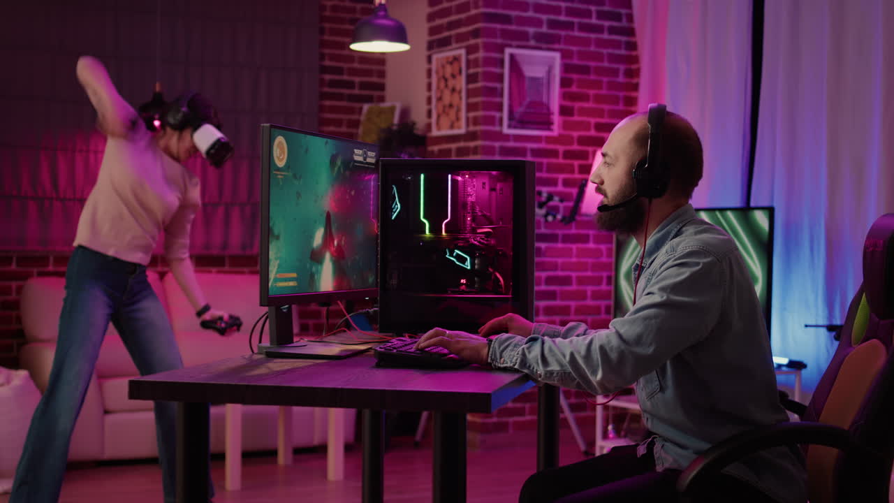 Gamer girl playing fighting game in virtual reality while boyfriend is streaming online space shooter