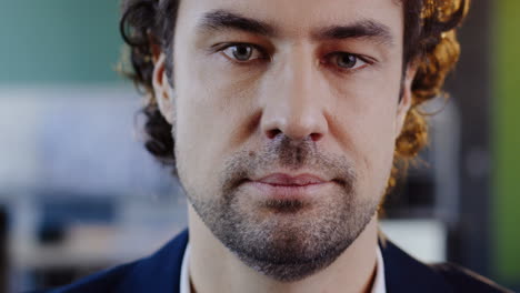 close-up view of caucasian businessman in glasses looking at camera in the office