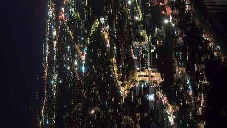 Vertical-night-timelapse-of-city-lights,-traffic-movement,-Tauranga,-New-Zealand