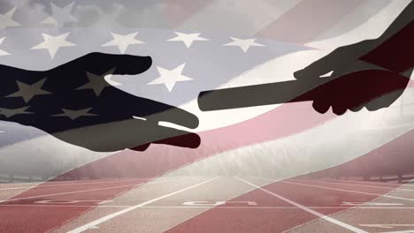 composite video of american flag over silhouette of hand passing a baton against sports track