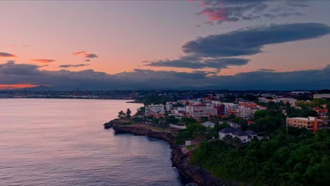 maleconcito coast and santo domingo city in background at sunset