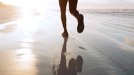 fitness, sea or legs of runner on sand in cardio