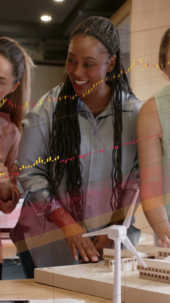 Vertical video: Woman leaning on model urging team tuning rotor for design as graphs crossing front