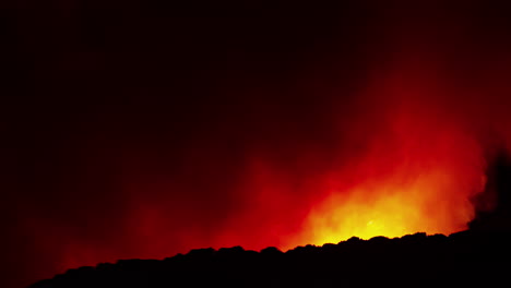 forest fire burning at night, time lapse on a mountain, nighttime, spain