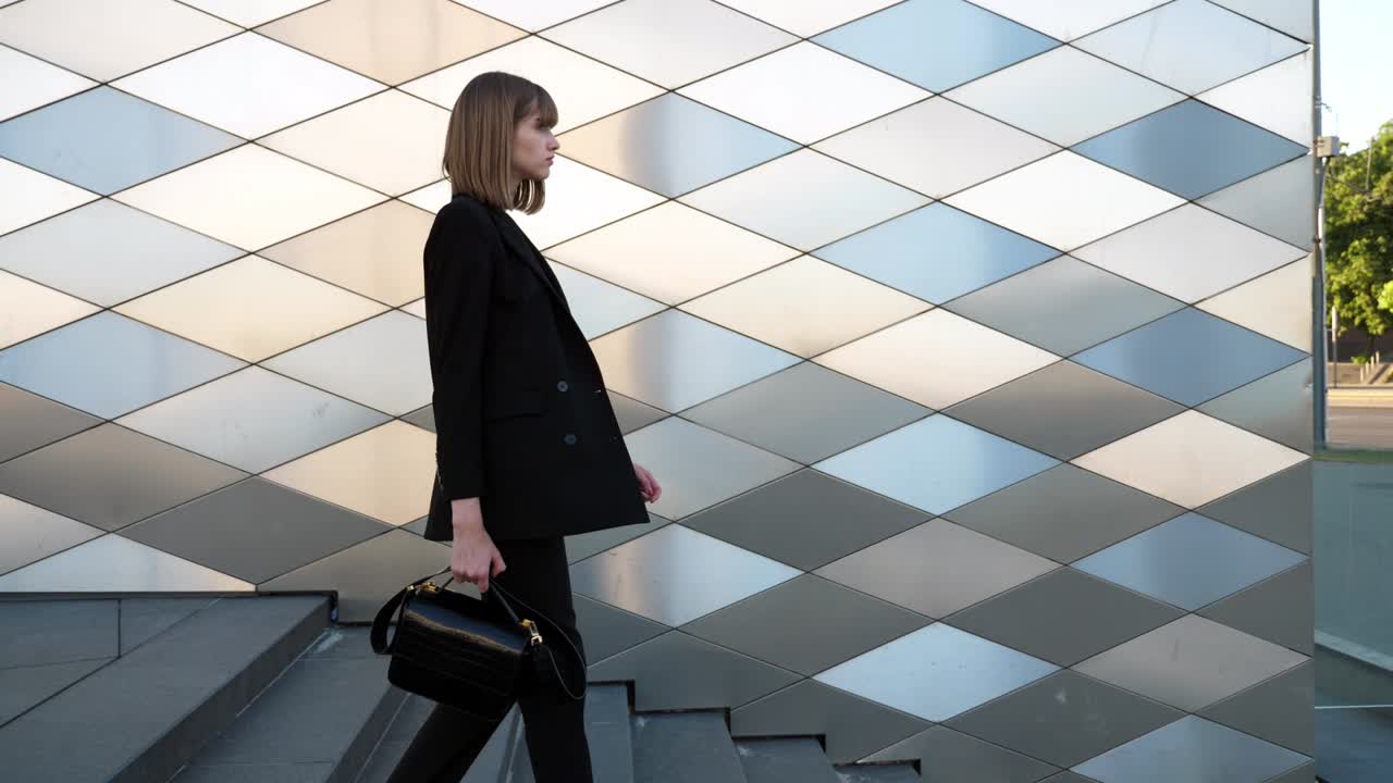Young businesswoman wearing suit walking to work