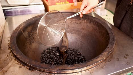 black beans being roasted and packaged