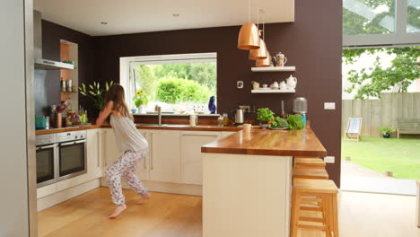 a cheerful woman dancing to music playing