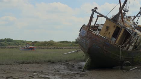 shipwrecks with cloud shadows moving across landscape