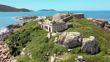 aerial drone top scene of ruins of an ancient abandoned and isolated fortress on a desert island fortaleza de nossa senhora da conceição de araçatuba florianopolis santa catarina brazil