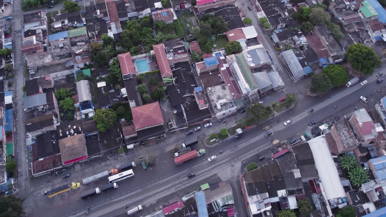 Lateral drone footage of El Placer in El Cerrito Valle del Cauca Colombia showing rooftops, road and rural landscape in a wide aerial shot