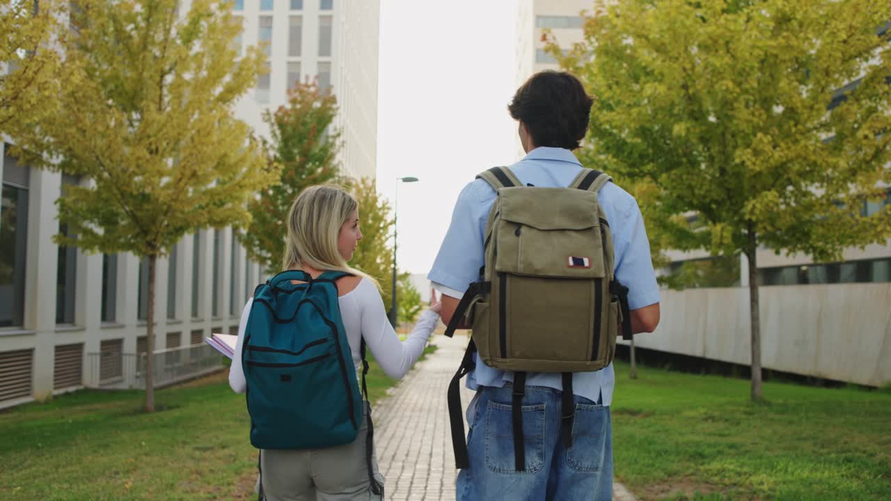 Students walking on campus with backpacks