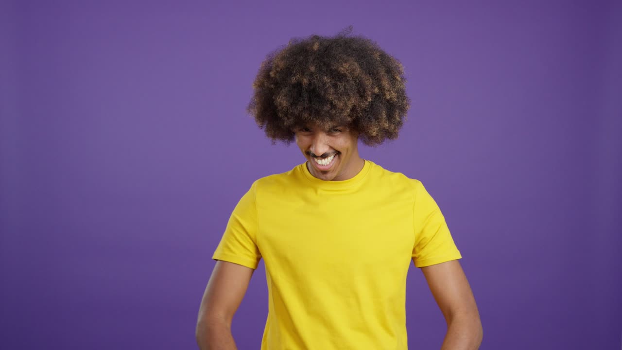 Man with afro giving thumbs up gesture