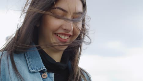 tilt up video of happy young woman using smart phone