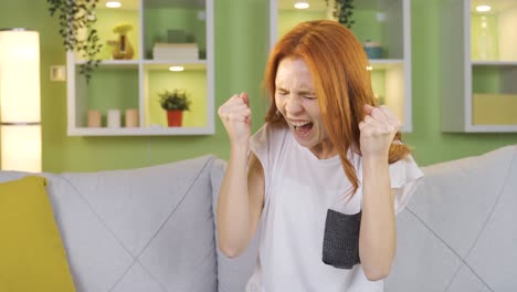 angry and nervous young woman at home, aggressive young woman.