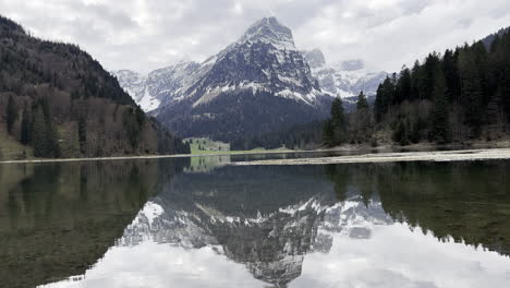 Mirror-like-reflection-of-majestic-Swiss-Alps-seen-in-Obersee-lake-water