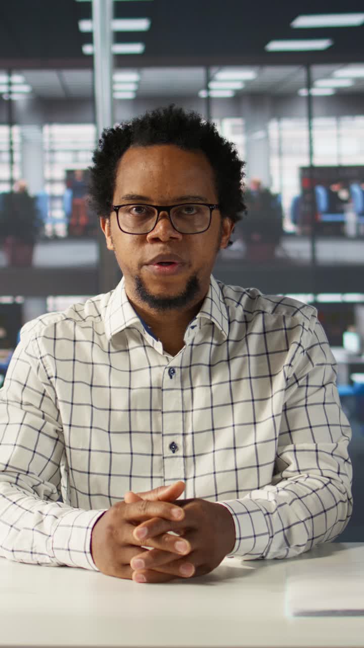 African American Man Talking and Gesturing During Video Call in Office