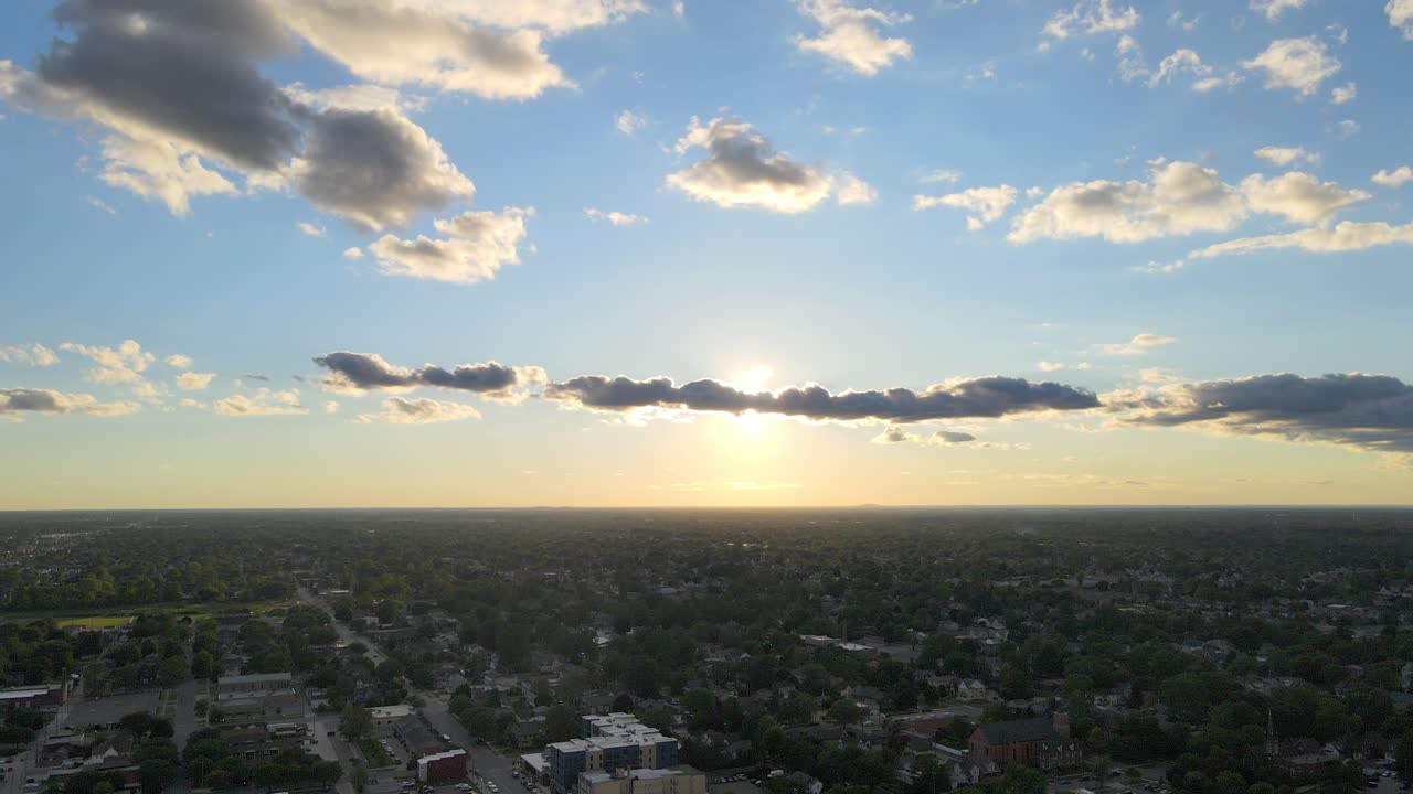 Sunset over suburban neighborhood with clouds in Wyandotte Michigan, USA